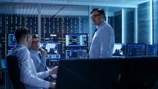 IT professionals meet in a server room