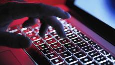 Hand on backlit keyboard