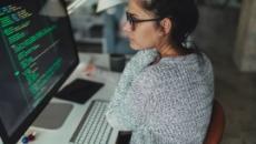 Person looking at code on a computer screen
