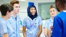 Medical students discussing with their manager